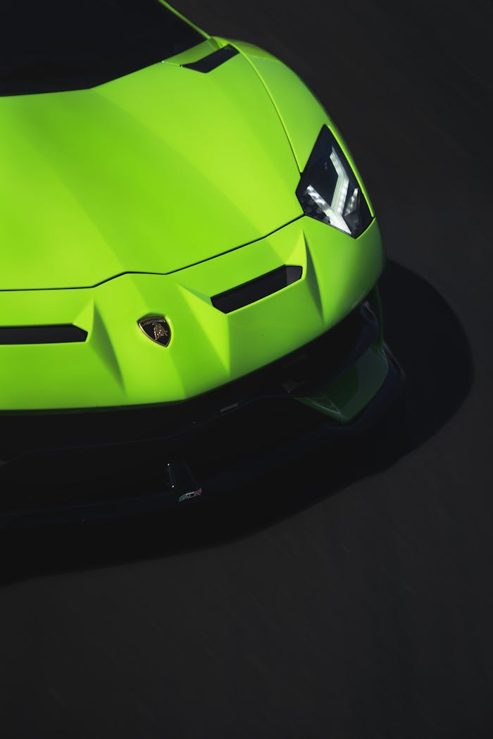 A striking close-up of a luxury green sports car